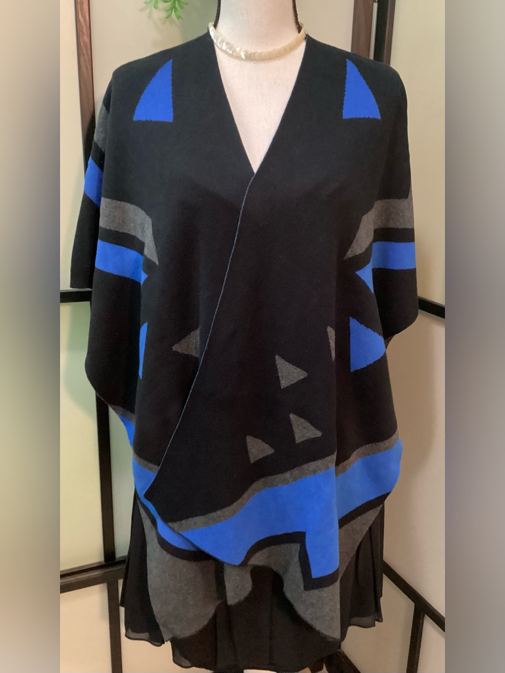 Warm elegant knitted cape/wrap